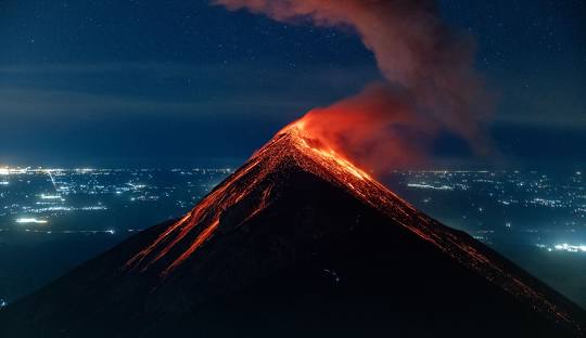 The powerful Fuego Volcano erupting, offering an unforgettable experience for adventurers in Guatemala.